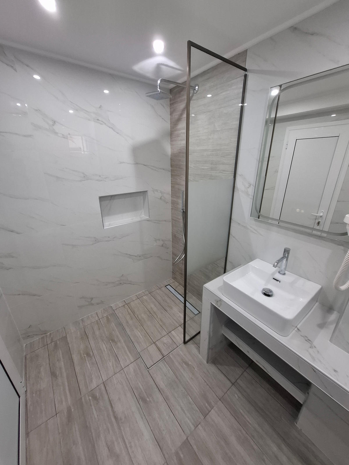 Clean studio bathroom with shower - Theramvos Studios Kassandra